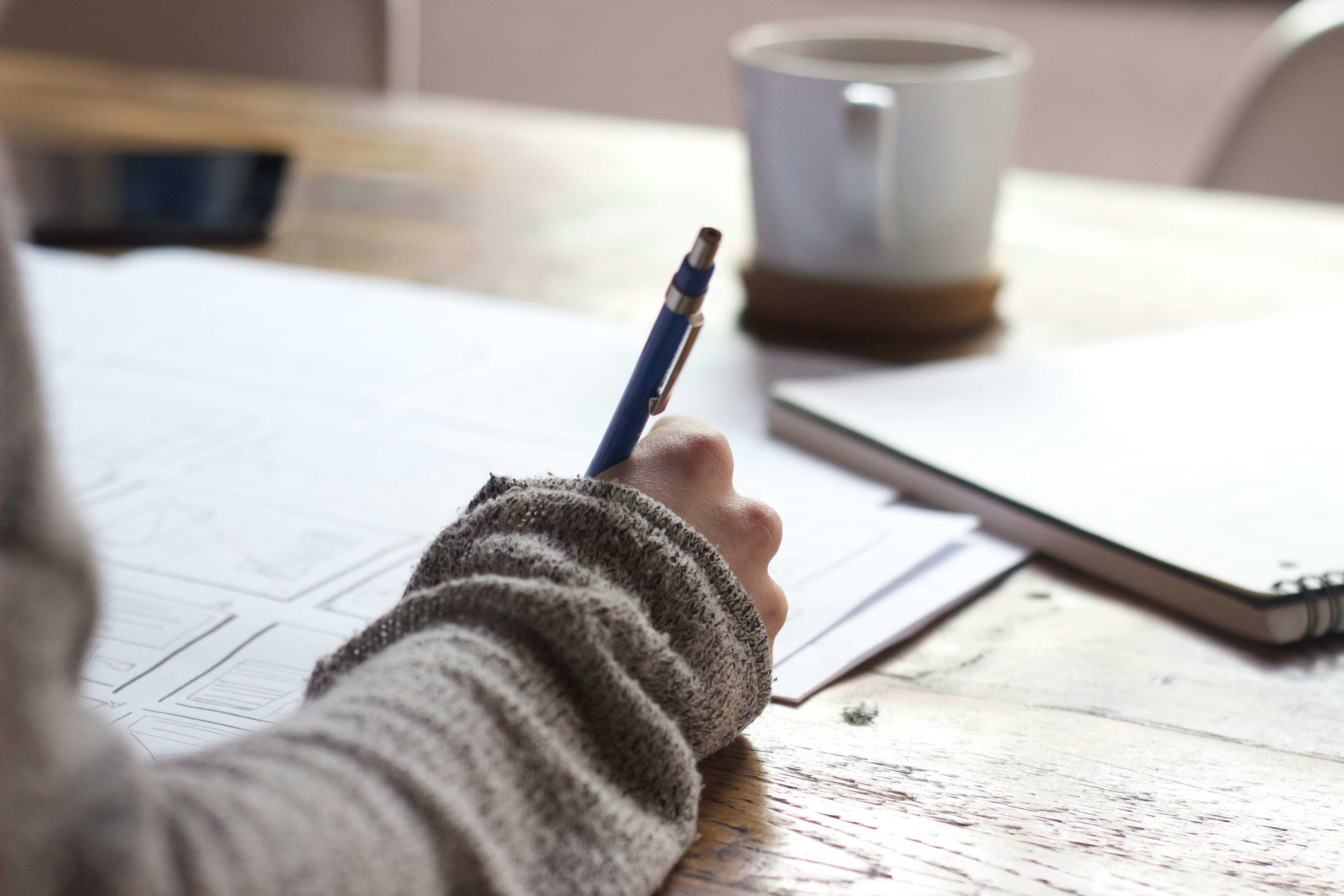 A professional reviewing coursework for an internationally recognised diploma programme